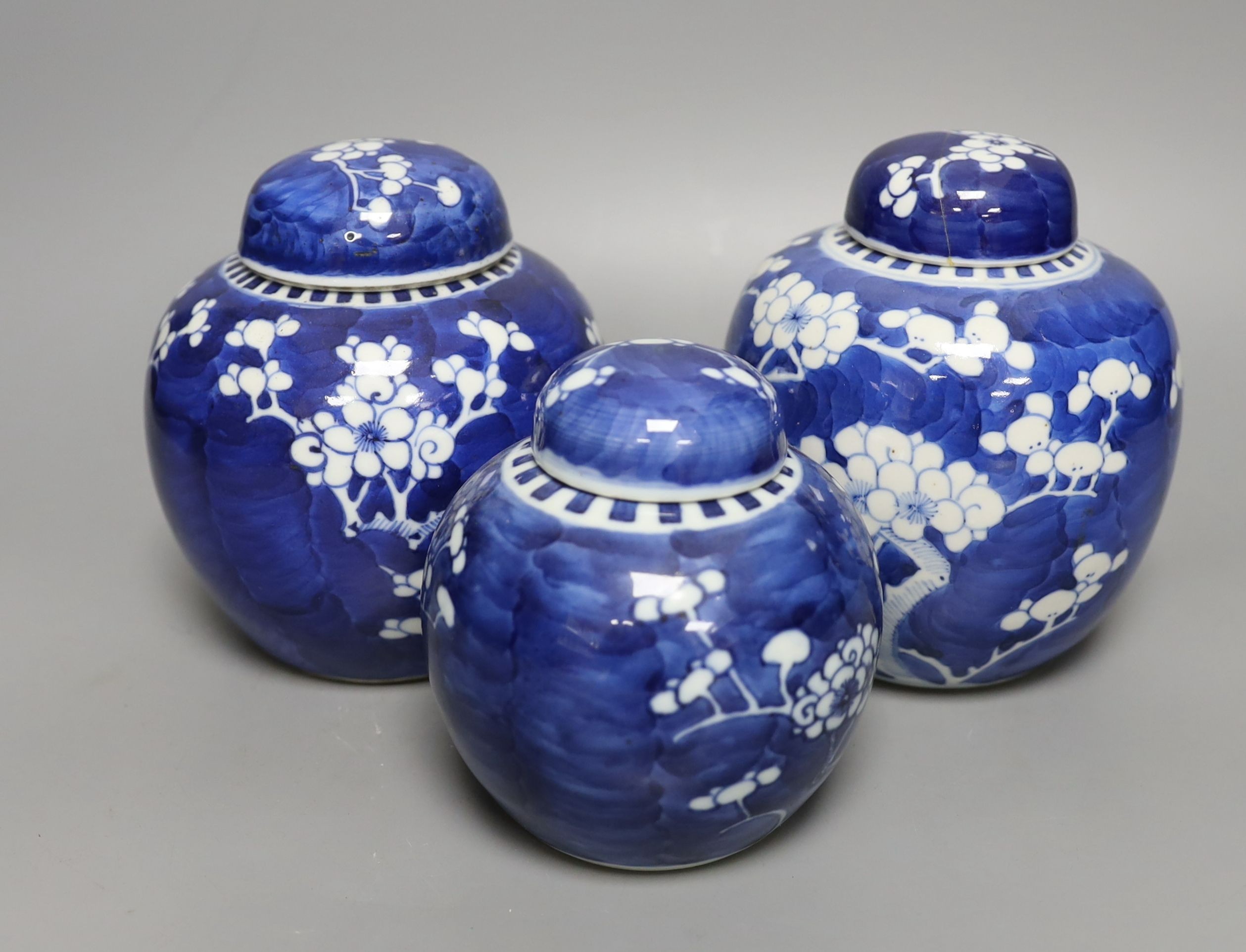 Three 19th century graduated Chinese blue and white ginger jars and covers